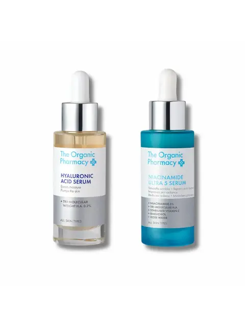 Two bottles of The Organic Pharmacy serums: Hyaluronic Acid and Niacinamide Ultra 5.