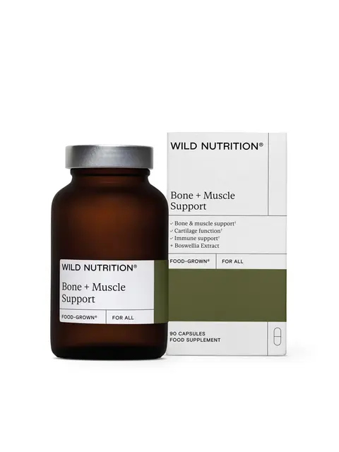 Brown bottle and box of Wild Nutrition Bone + Muscle Support capsules.