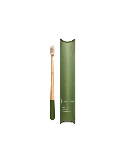 Bamboo toothbrush with green handle and matching green packaging.