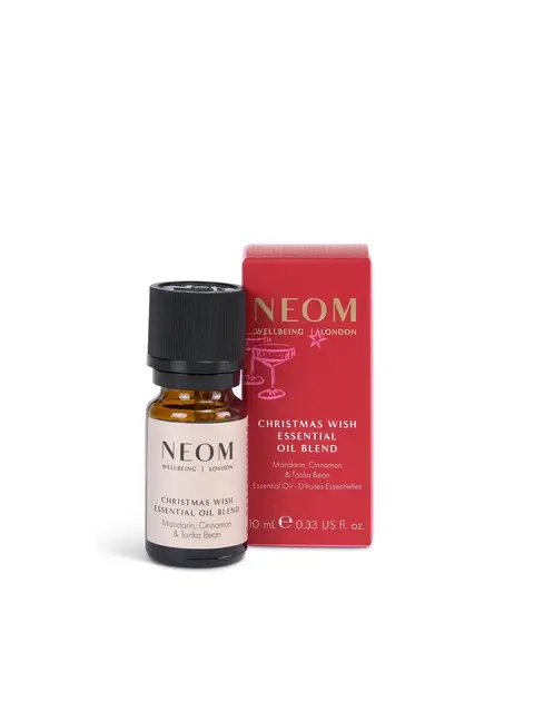 Essential oil bottle and red box, labelled "NEOM Christmas Wish Essential Oil Blend".