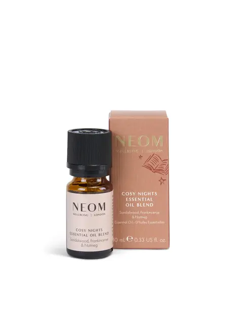 Neom Cosy Nights Essential Oil Blend with sandalwood, frankincense, and nutmeg. 10 ml bottle.