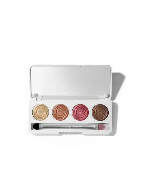 Open eyeshadow palette with four shades and a brush.