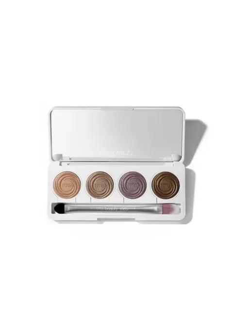 Open eyeshadow palette with four shades and a brush.