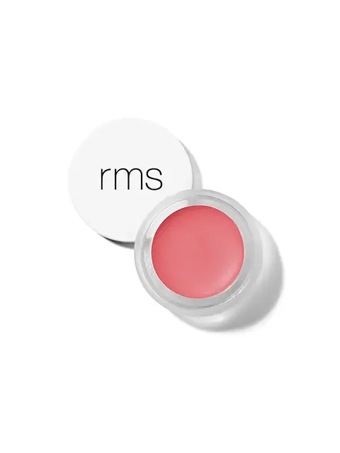 Open jar of pink lip balm with "rms" on the white lid.