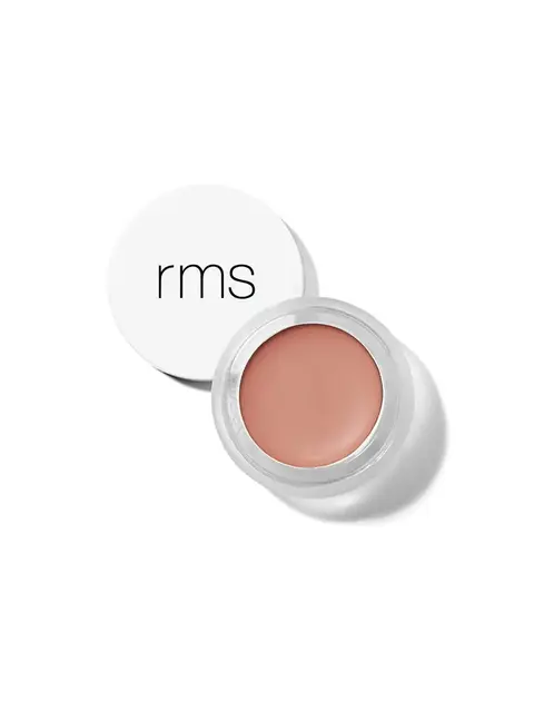 Open jar of peach-coloured cream with "rms" on the lid.