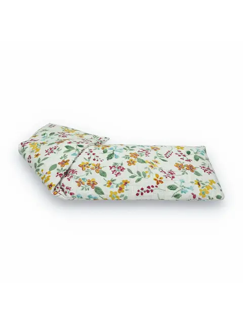 Floral-patterned fabric eye pillow with yellow, red, and blue flowers.