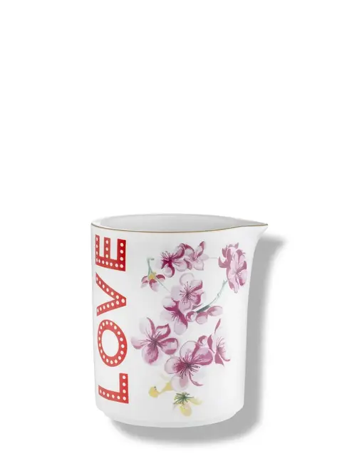 White mug with "LOVE" in red and pink floral design.
