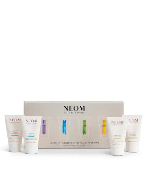 NEOM hand balm set with four tubes and branded packaging.