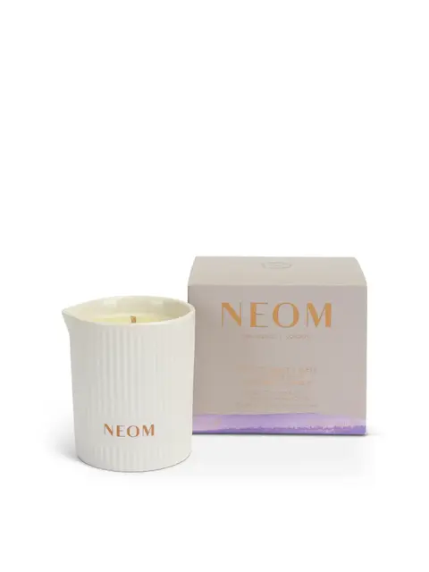 NEOM candle in a ribbed white holder with matching box.