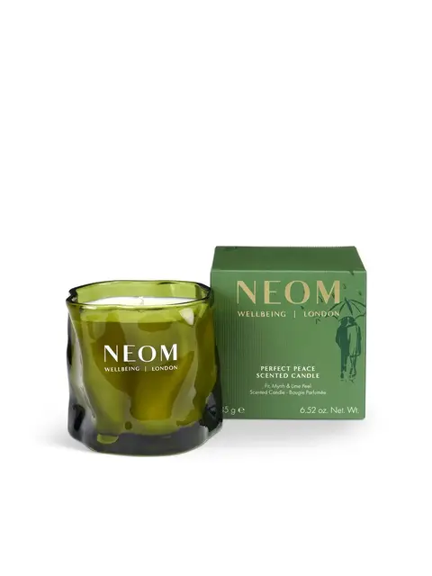 Green NEOM candle and box, labelled "Perfect Peace Scented Candle".