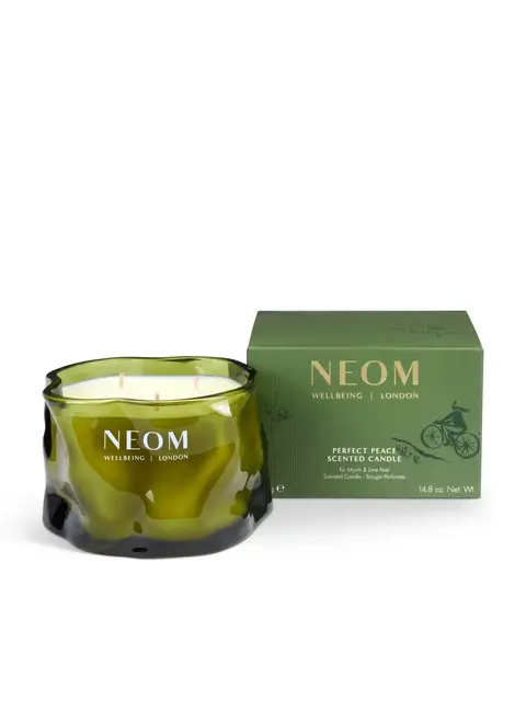 Green NEOM candle and box, labelled "Perfect Peace Scented Candle".