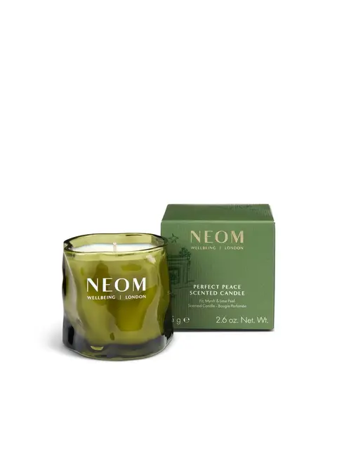 Green NEOM candle and box, labelled "Perfect Peace Scented Candle".