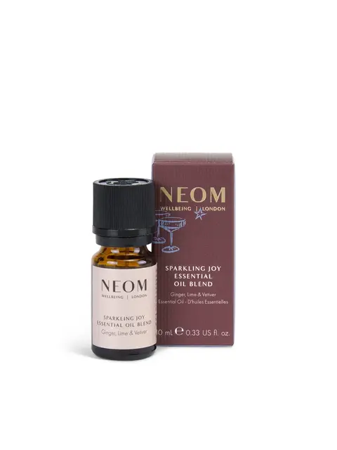 Neom Sparkling Joy essential oil blend, ginger, lime, vetiver, 10ml bottle with box.