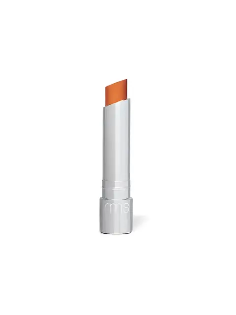 Silver lipstick tube with orange lipstick, "rms" on the base.