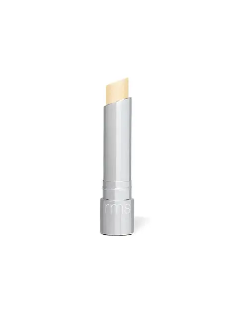 Silver tube of lip balm with "rms" logo, beige balm exposed.