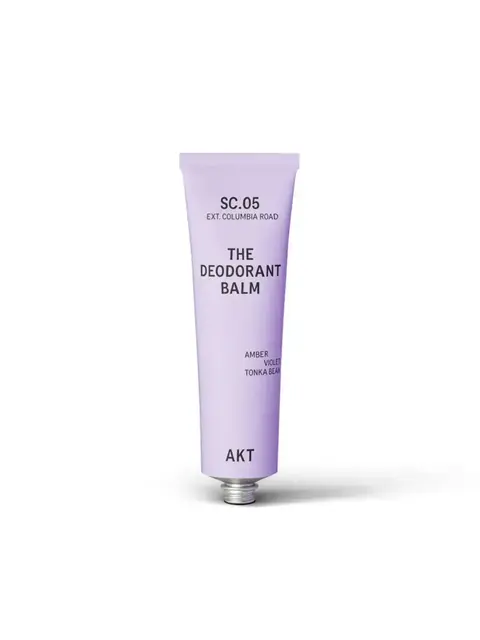 Lavender tube labelled "The Deodorant Balm" with notes of amber, violet, and tonka bean.