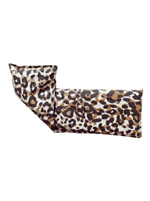 Leopard print fabric eye pillow folded at one end.