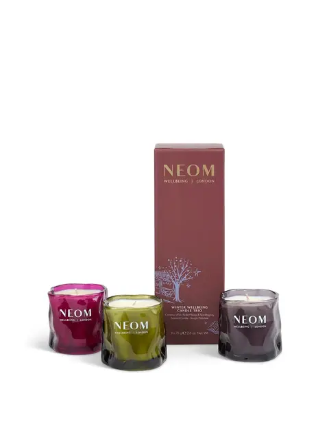Neom Winter Wellbeing Candle Trio with red, green, and purple glass holders.
