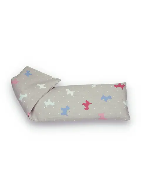 Grey fabric eye pillow with colourful dog pattern.