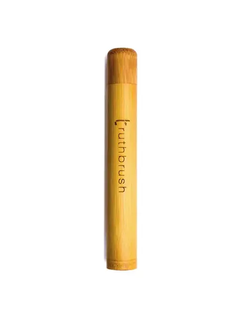 Bamboo toothbrush case with "truthbrush" text.
