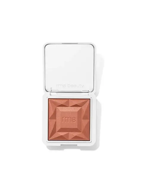 Open compact with embossed peach powder and "rms beauty" text on lid.