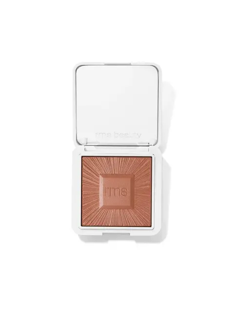 Open compact with brown powder, embossed "rms" and "rms beauty" on lid.