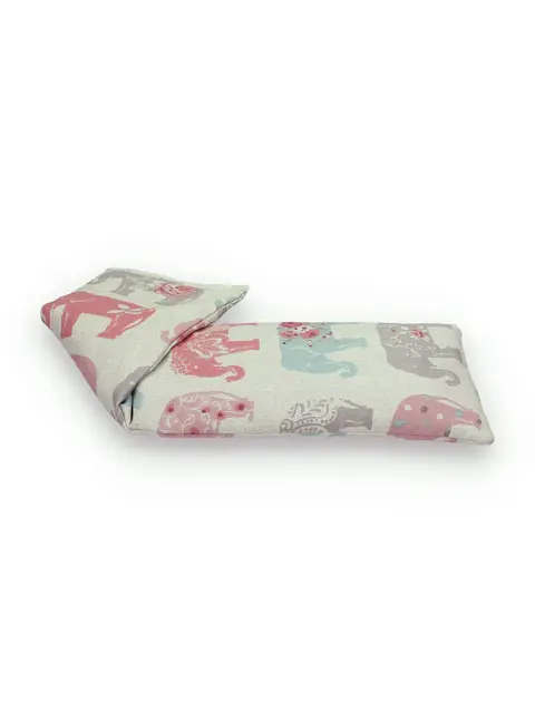Rectangular fabric heat pack with pink and blue elephant pattern.