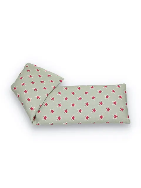 Grey eye pillow with red star pattern, folded at one end.