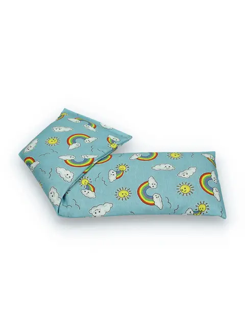 Blue fabric with rainbows, clouds, and sun pattern on a rectangular cushion.