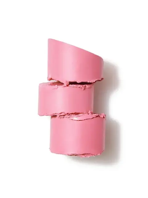 Three stacked pink lipstick chunks on a white background.