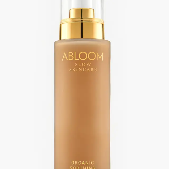 Abloom Slow Skincare Organic Soothing Lotion in a gold-capped bottle.