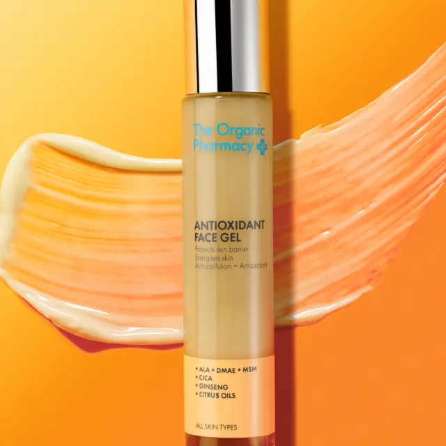 Antioxidant Face Gel by The Organic Pharmacy on orange background with gel smear.