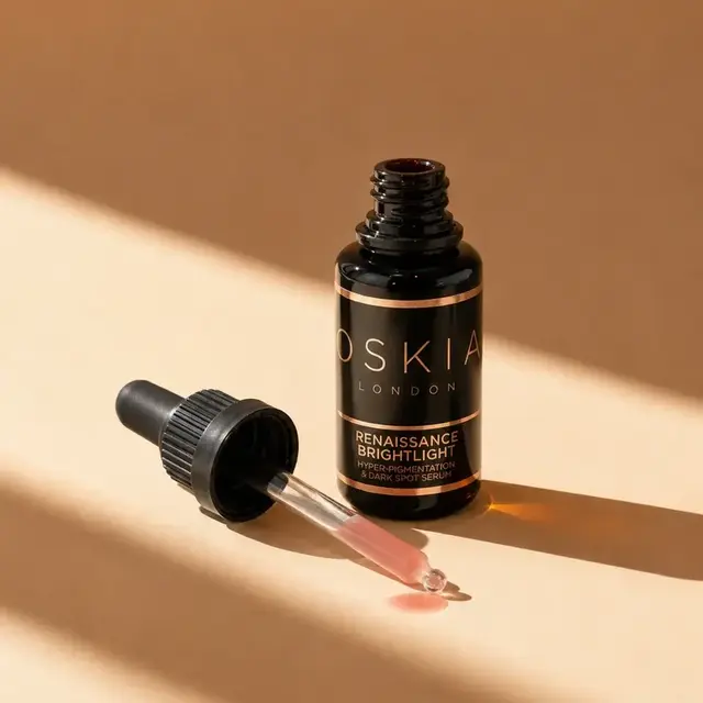 Oskia London Renaissance Brightlight serum with dropper on beige background.