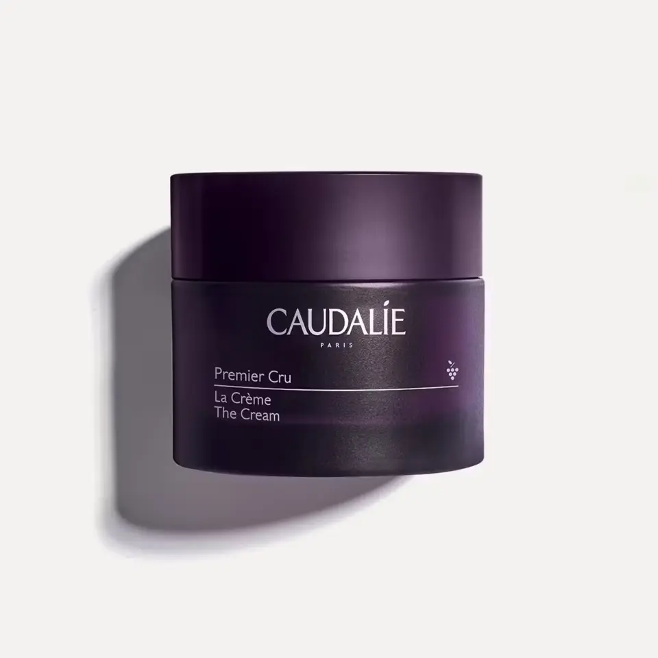 Caudalie Premier Cru La Crème in a dark purple jar on a white background.