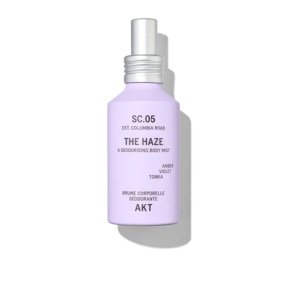 Lavender bottle of AKT The Haze deodorising body mist with silver cap.
