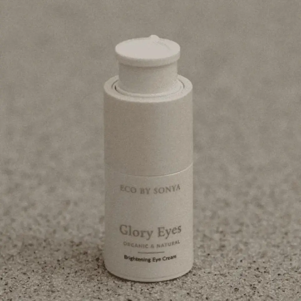 Eco by Sonya Glory Eyes Brightening Eye Cream on speckled surface.