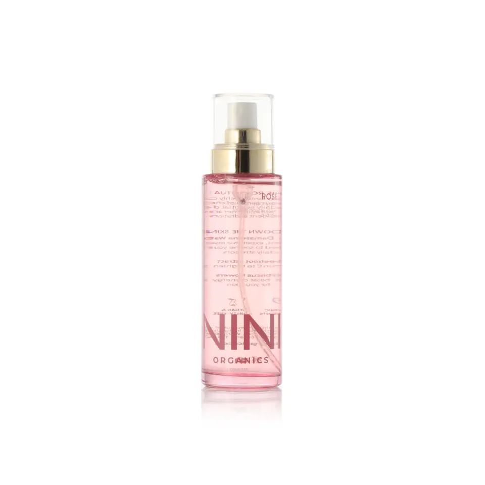 Pink spray bottle with gold cap, labelled "NINI Organics".