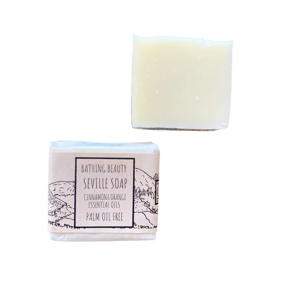 Two bars of Seville soap, one wrapped, one unwrapped. Label reads: "Palm oil free".