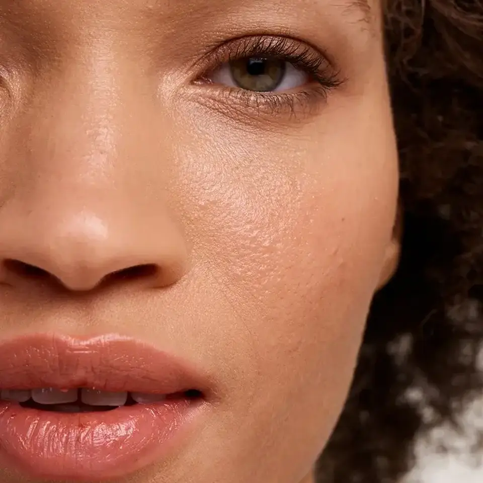 Close-up of a person's face showing smooth skin and natural lip colour.