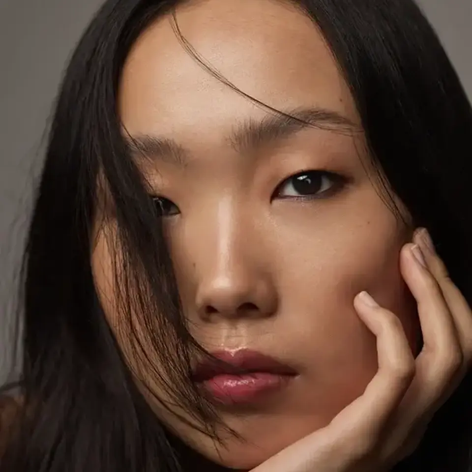 Person with long dark hair, hand on face, text "IVORY" in corner.
