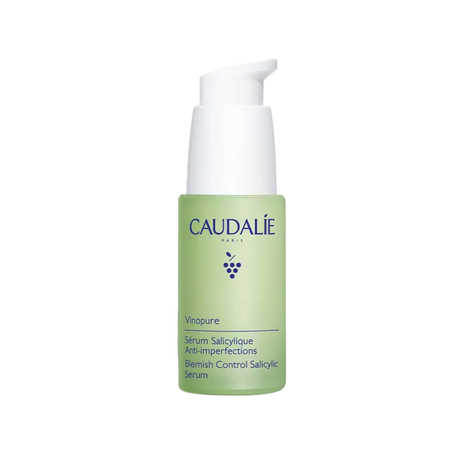 Caudalie Vinopure Blemish Control Salicylic Serum in a green pump bottle.