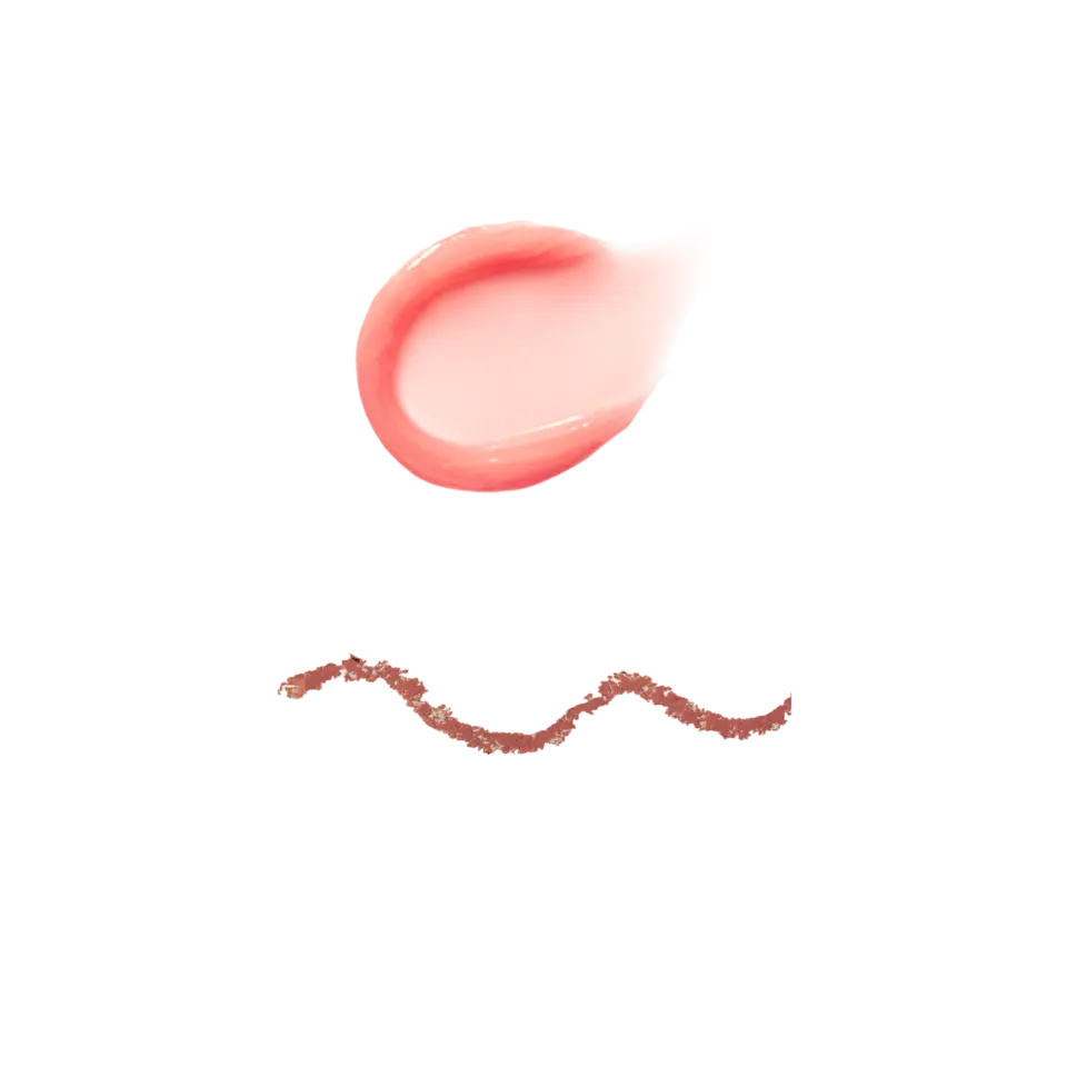 Pink cream smear above a wavy line of brown scrub on a black background.