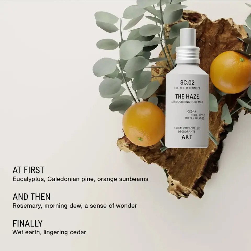 Body mist bottle with eucalyptus, oranges, and text describing scent notes.
