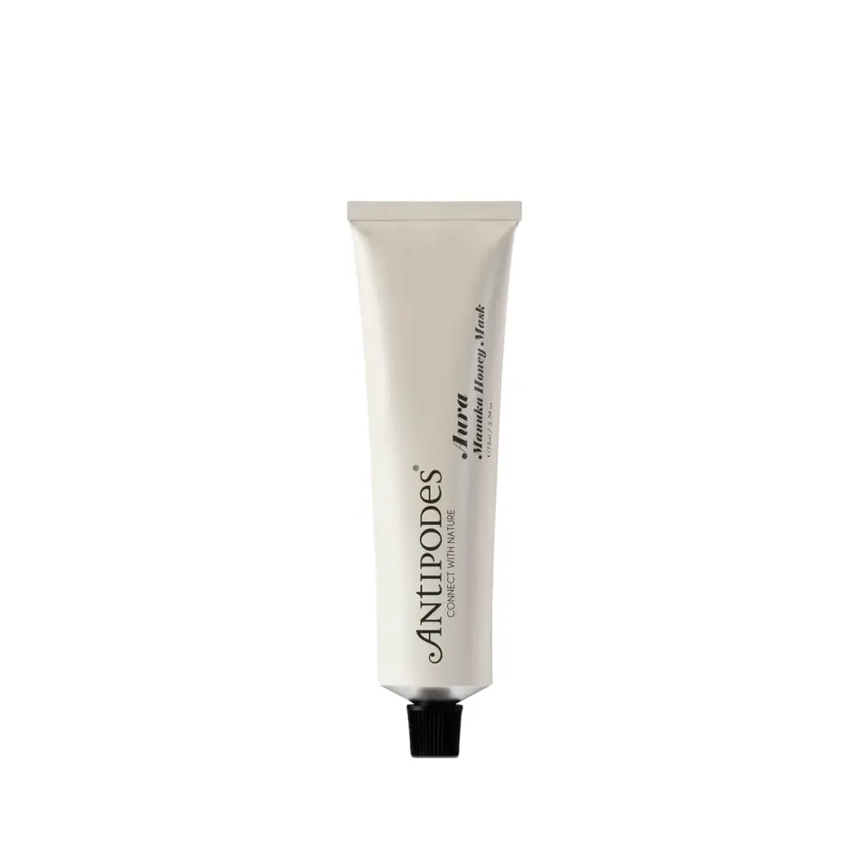 Antipodes Aura Manuka Honey Mask tube with black cap on white background.
