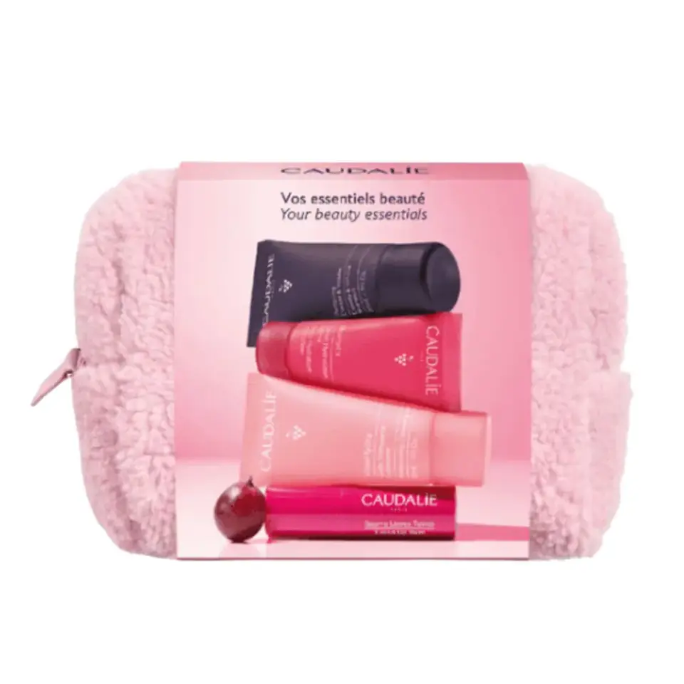Pink toiletry bag with Caudalie skincare products and text "Your beauty essentials".