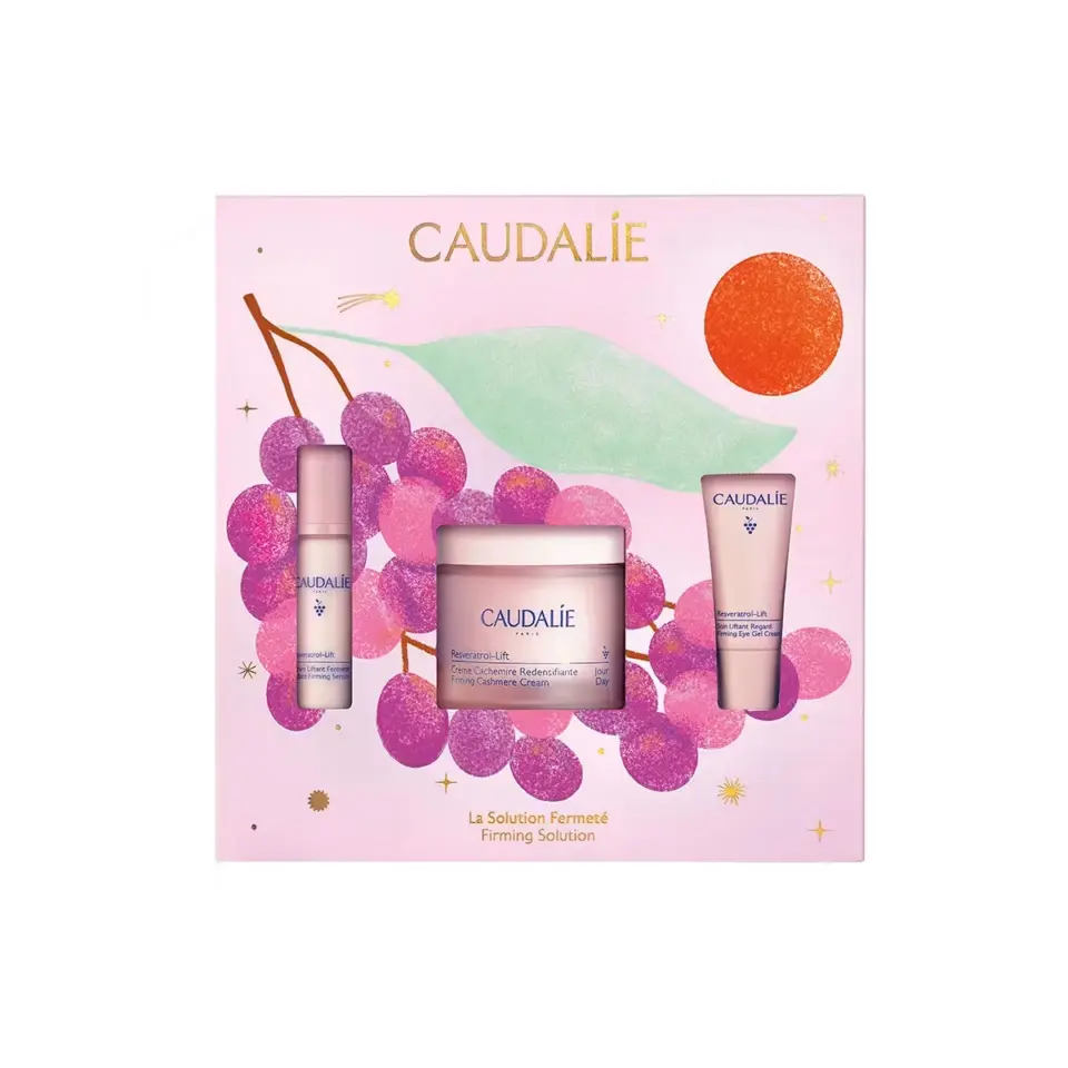 Caudalie skincare set with grape design and firming solution text.