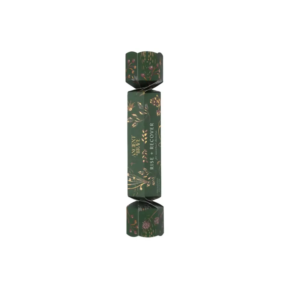 Green cracker with floral design, text "Moment of Tranquillity" and "Rise + Recover".