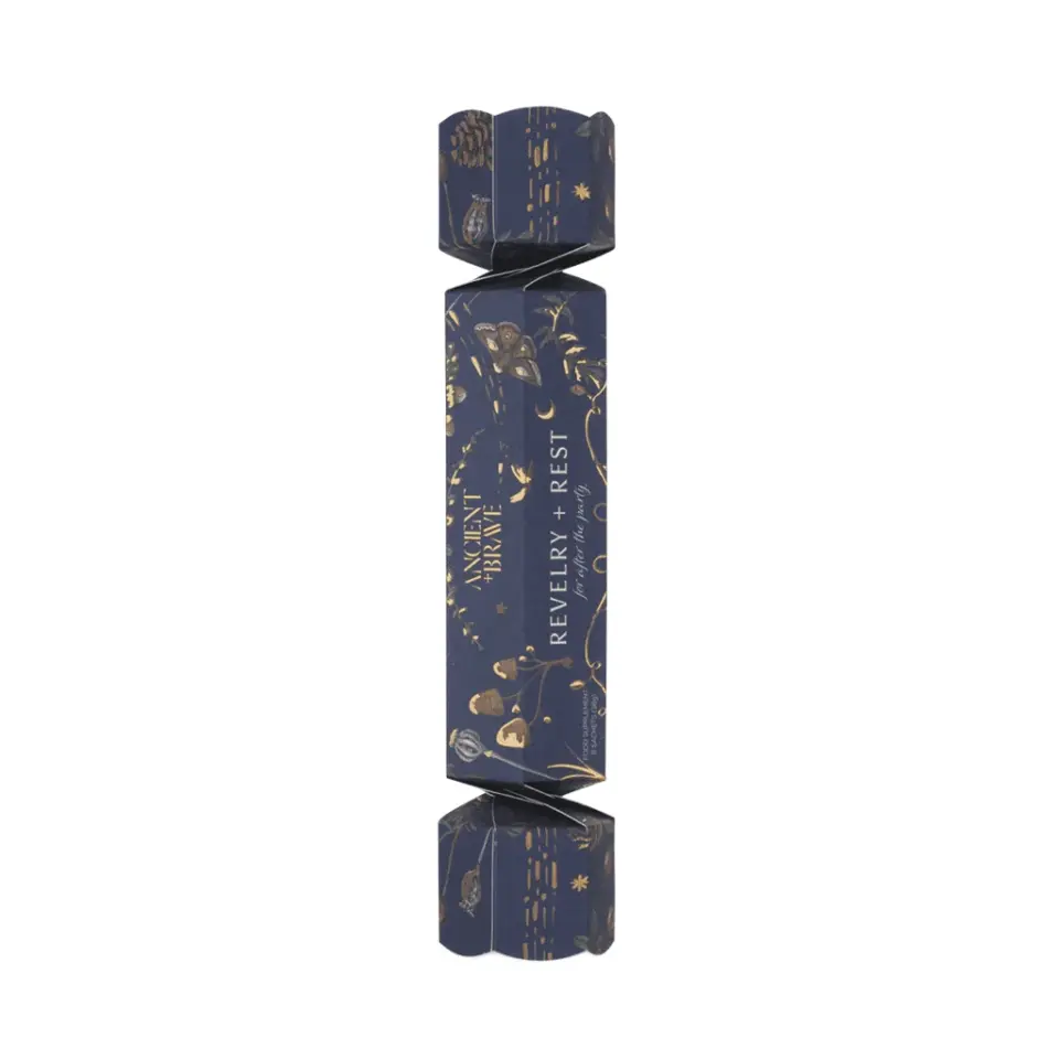 Navy and gold cracker with "Ancient + Brave" and "Revelry + Rest" text.