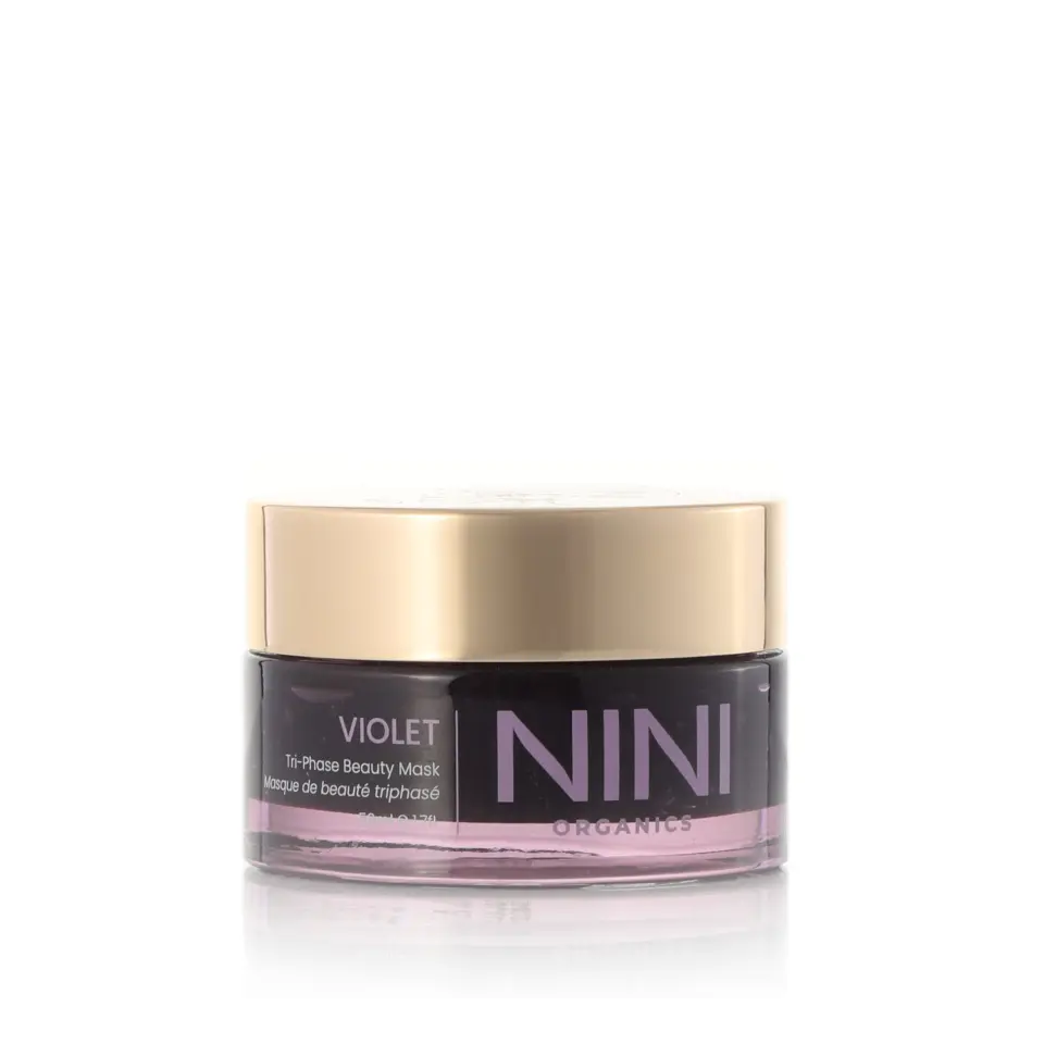 NINI Organics Violet Tri-Phase Beauty Mask in a clear jar with a gold lid.