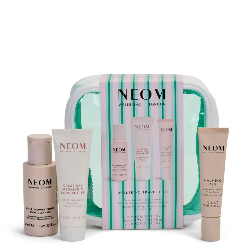 NEOM Wellbeing Travel Edit set with body cleanser, body butter, and calming pen.